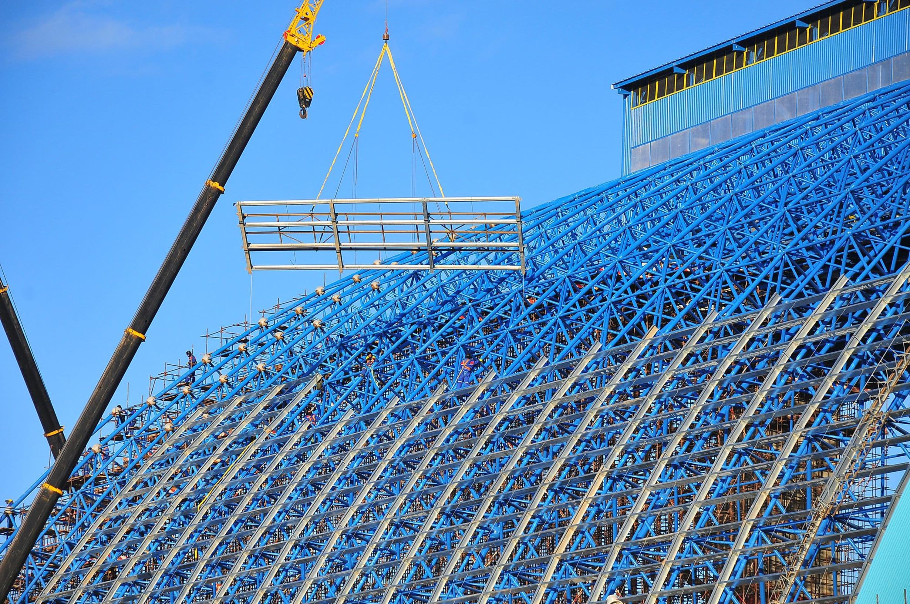 Two large cranes erecting steel supports