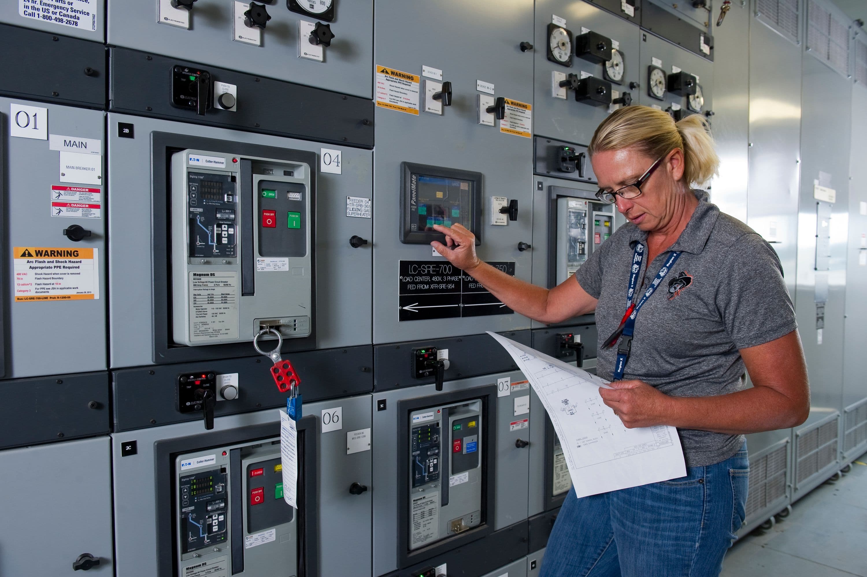 An operator monitors the Integrated Waste Treatment Unit