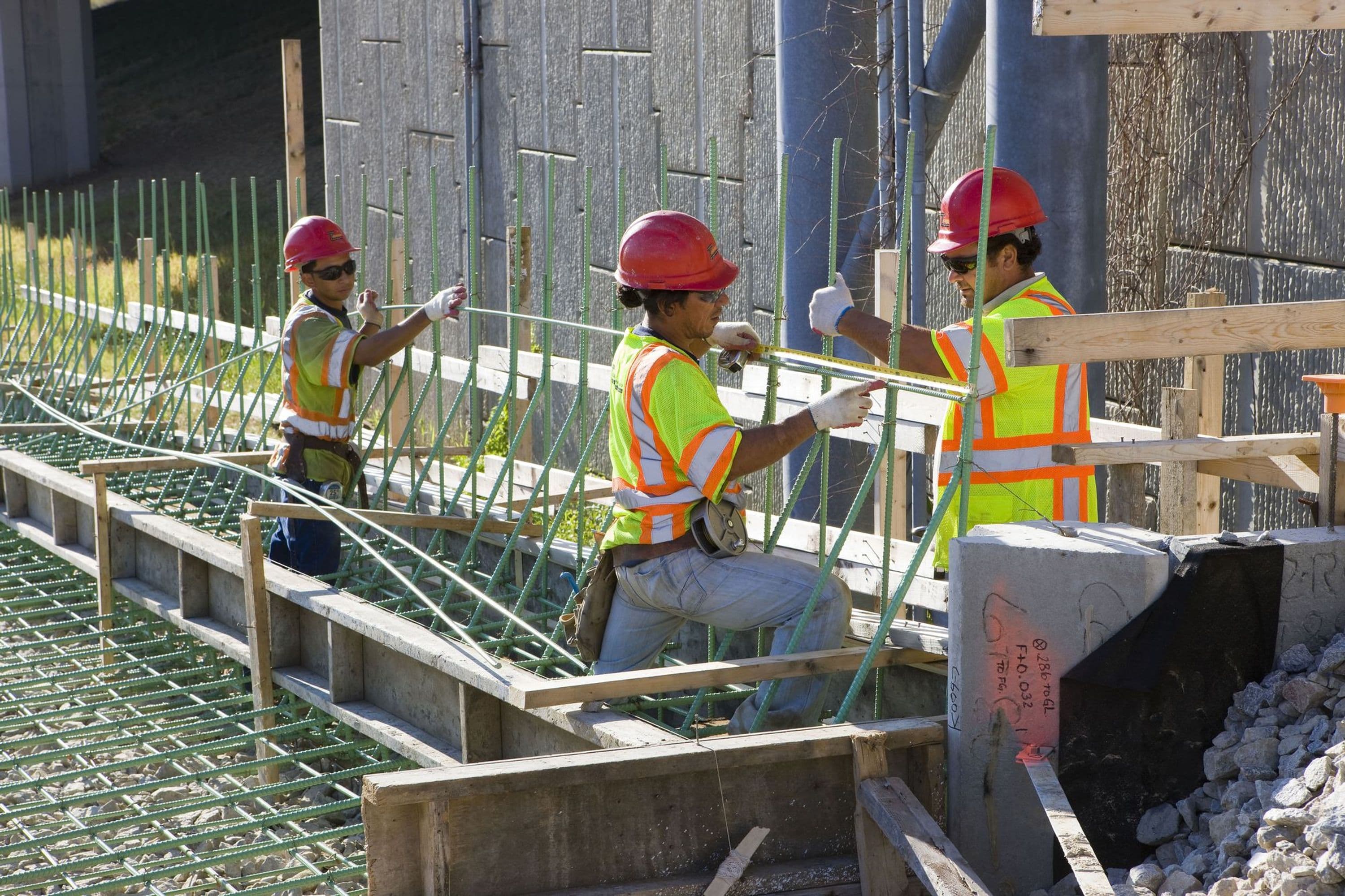 Workers setting rebar