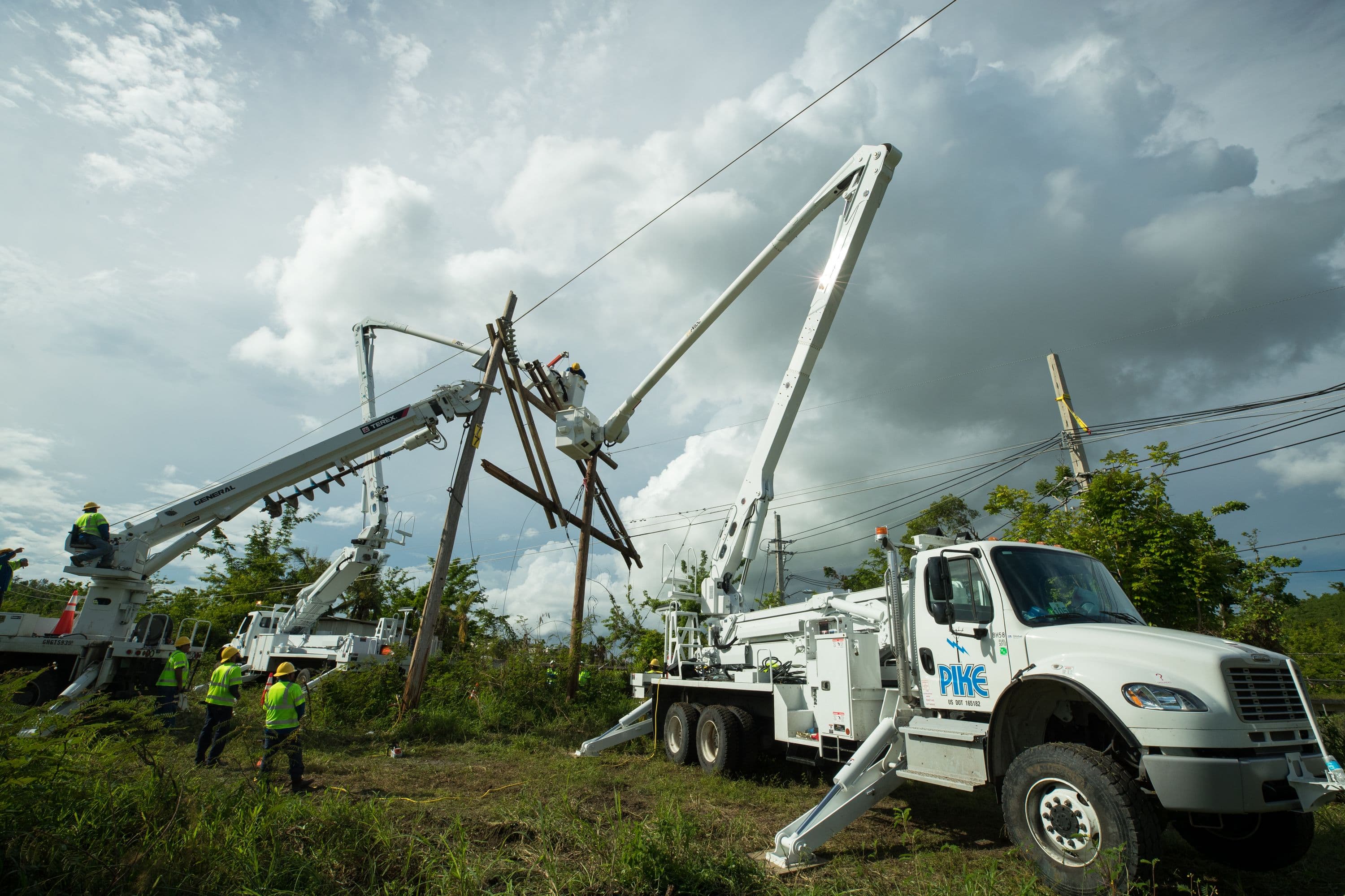 Transmission crew repairing downed power lines and poles
