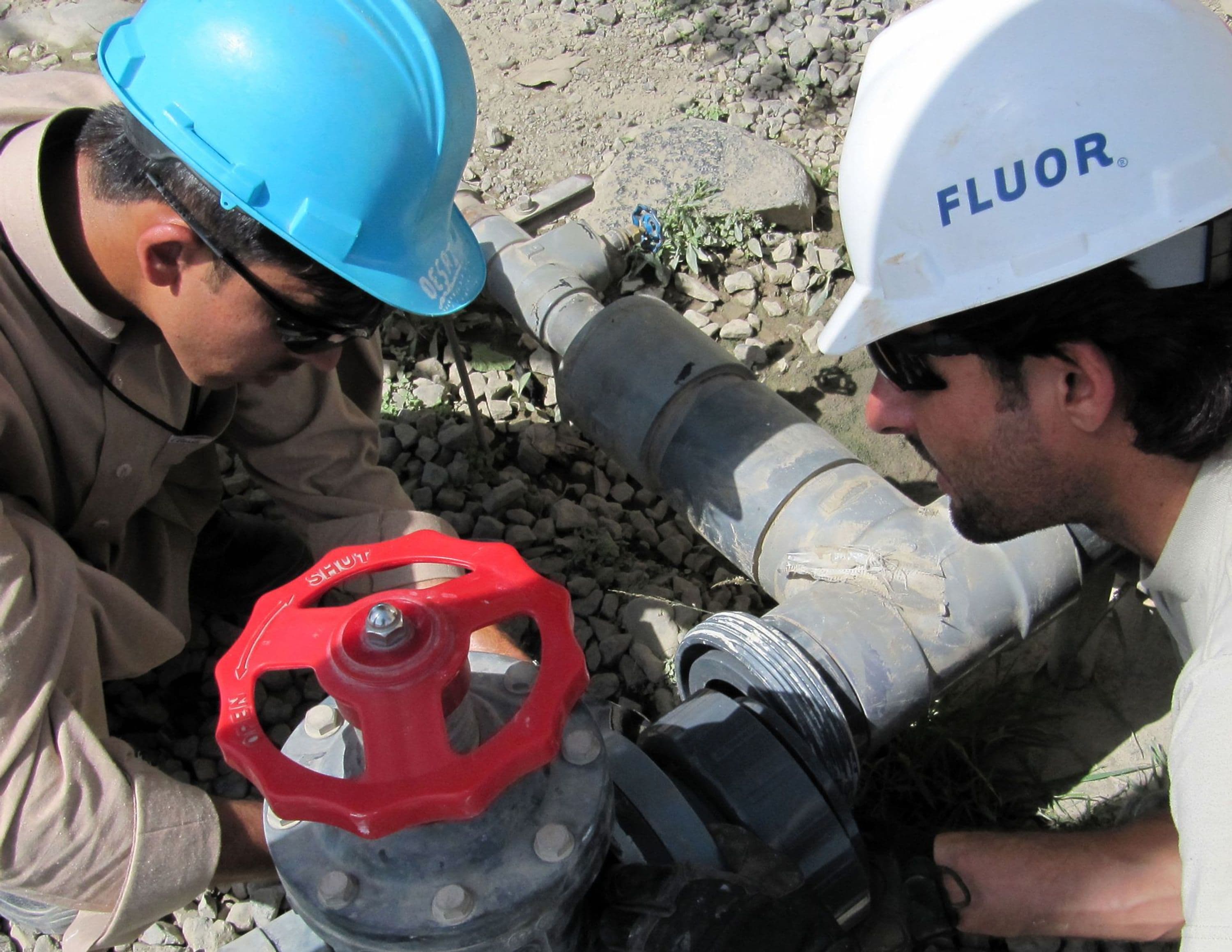 Employees repairing main water line at Forward Operating Base Salemo