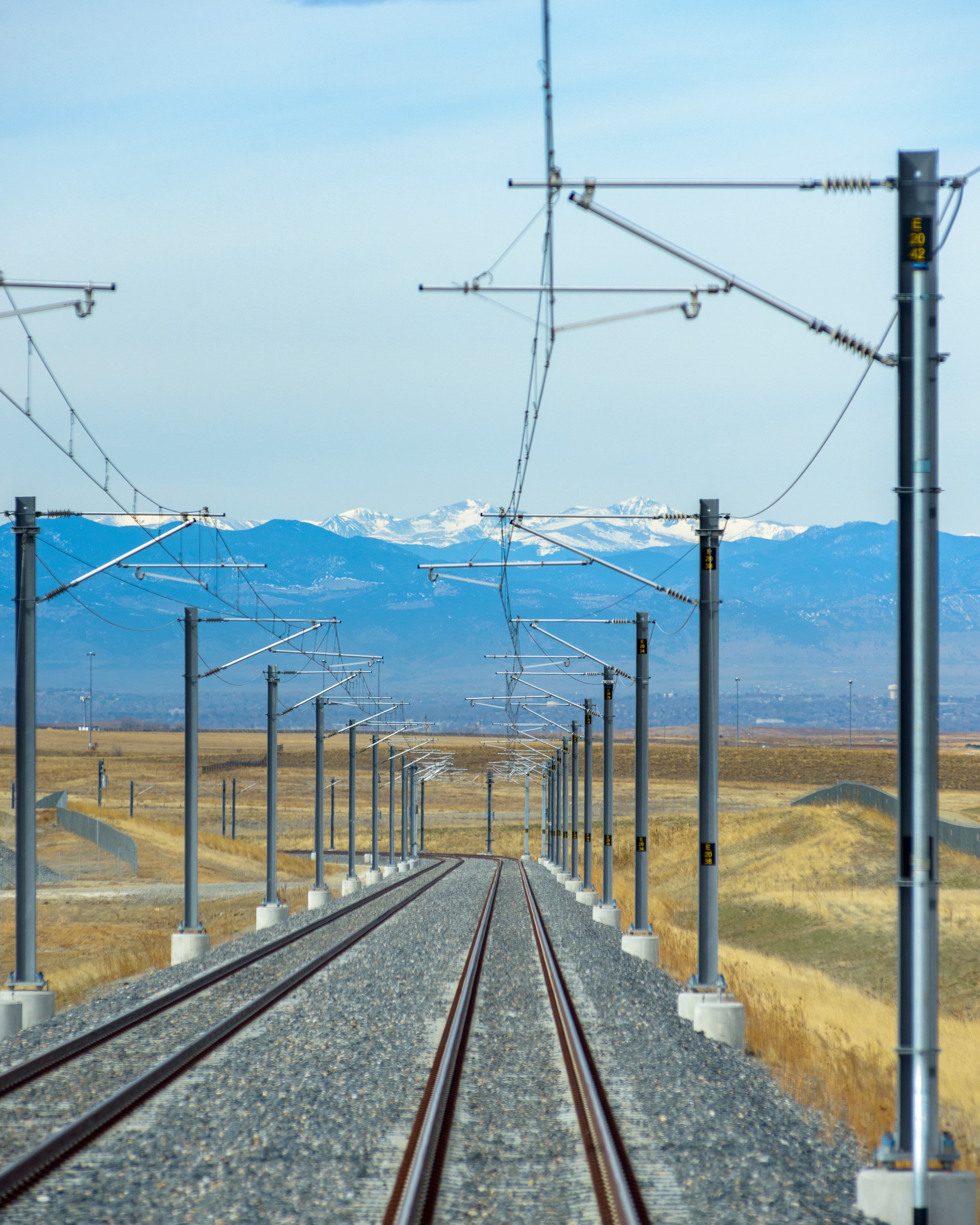 Photo of tracks with mountains in the distance