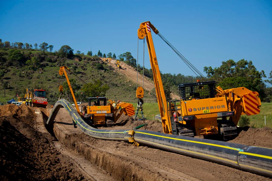 Construction equipment working on pipeline